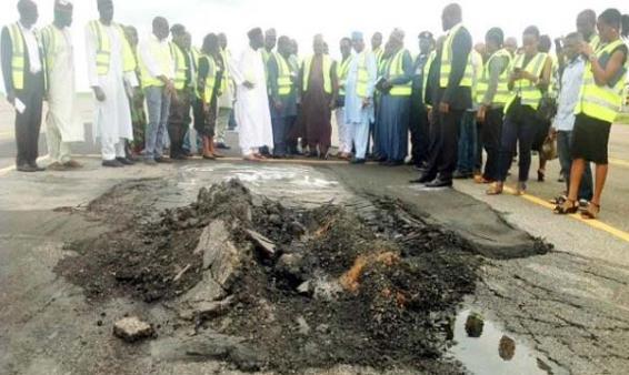 a damaged section of the abuja airport runway which has been closed for rehabilitation
